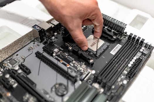 pexels-photo-7596370-7596370 Person's hand installing a CPU on a motherboard, showcasing PC maintenance and repair.
